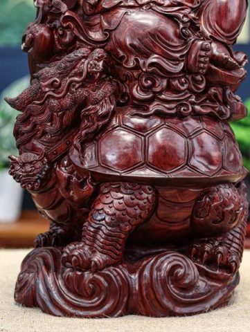 Di lặc cưỡi long quy tử đàn