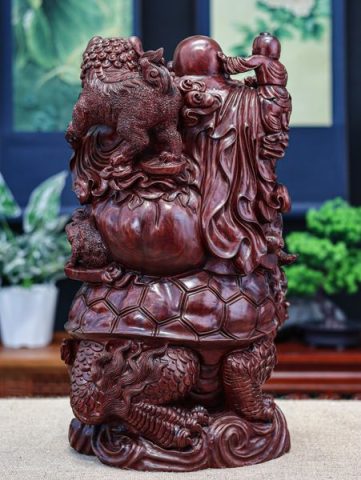 Di lặc cưỡi long quy tử đàn
