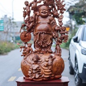 Di Lạc Vác Cành Đào Ngũ Tiểu Đứng Bao Tiền Gỗ Nu Hương