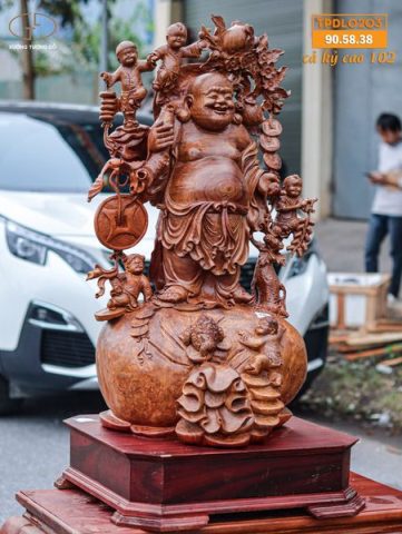 Di Lạc Vác Cành Đào Ngũ Tiểu Đứng Bao Tiền Gỗ Nu Hương