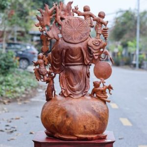 Di Lạc Vác Cành Đào Ngũ Tiểu Đứng Bao Tiền Gỗ Nu Hương