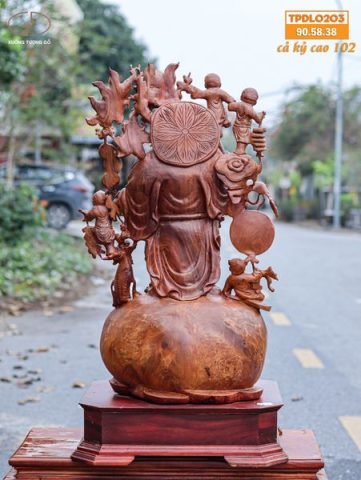 Di Lạc Vác Cành Đào Ngũ Tiểu Đứng Bao Tiền Gỗ Nu Hương