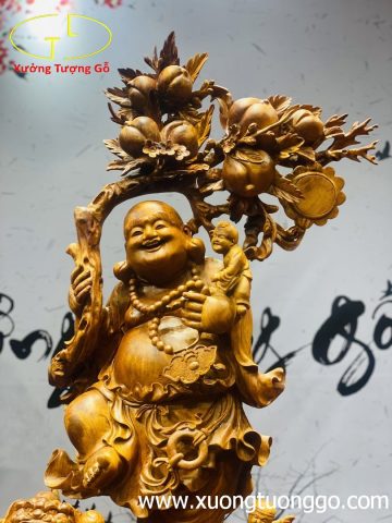 Di Lặc ngũ phúc vác cành đào gỗ hương ta. Di Lặc ngũ phúc vác cành đào gỗ hương ta.