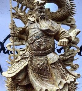 Quan công cầm đao gỗ mun đuôi công.