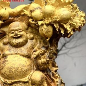 Di Lặc nhị tiểu vác đào nu hương.