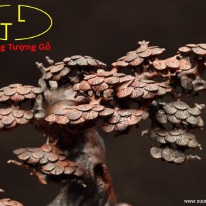 Di Lặc ngồi voi gỗ trắc.