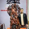 Di Lặc cửu tiểu vác đào đứng tùng gỗ trắc