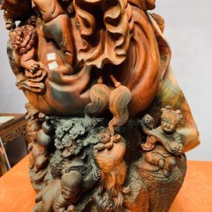 Di Lặc cửu tiểu vác đào đứng tùng gỗ trắc