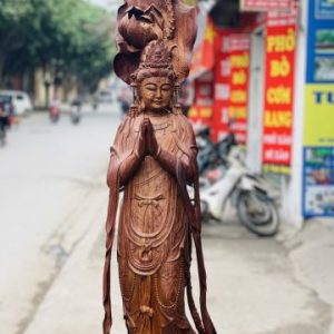 Quan Âm ngự cá chép hóa rồng gỗ cẩm. Quan Âm ngự cá chép hóa rồng gỗ cẩm.