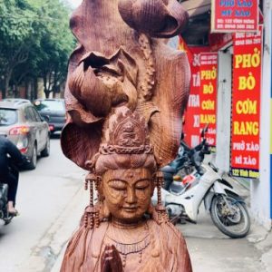 Quan Âm ngự cá chép hóa rồng gỗ cẩm. Quan Âm ngự cá chép hóa rồng gỗ cẩm.