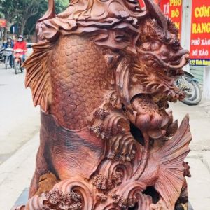 Quan Âm ngự cá chép hóa rồng gỗ cẩm. Quan Âm ngự cá chép hóa rồng gỗ cẩm.