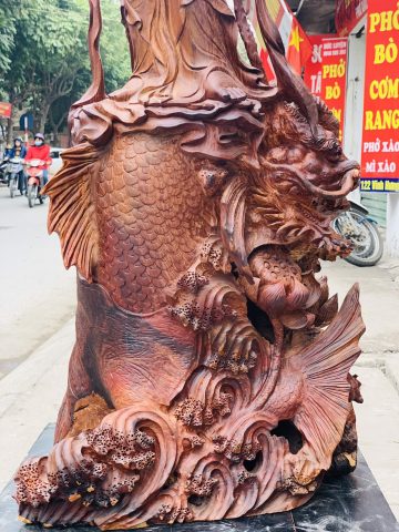 Quan Âm ngự cá chép hóa rồng gỗ cẩm. Quan Âm ngự cá chép hóa rồng gỗ cẩm.