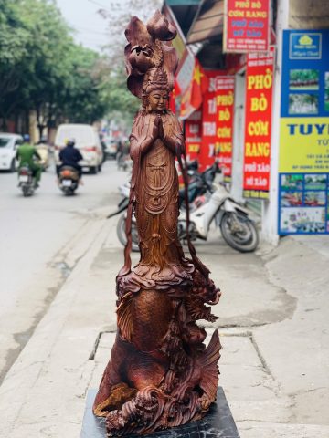 Quan Âm ngự cá chép hóa rồng gỗ cẩm. Quan Âm ngự cá chép hóa rồng gỗ cẩm.