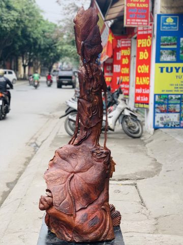 Quan Âm ngự cá chép hóa rồng gỗ cẩm. Quan Âm ngự cá chép hóa rồng gỗ cẩm.
