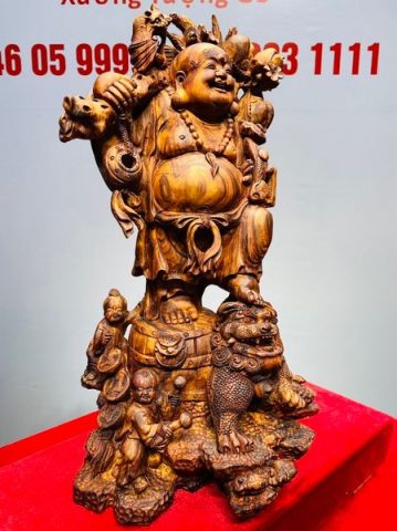 Tượng Di Lạc vác cành đào đứng Nghê Gỗ Sưa