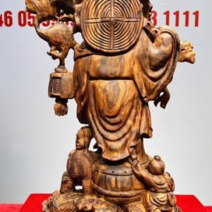 Tượng Di Lạc vác cành đào đứng Nghê Gỗ Sưa