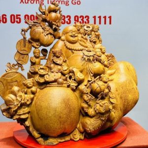Di Lạc Cửu Tiểu vác cành đào ngồi bao tiền Gỗ Nu Hương