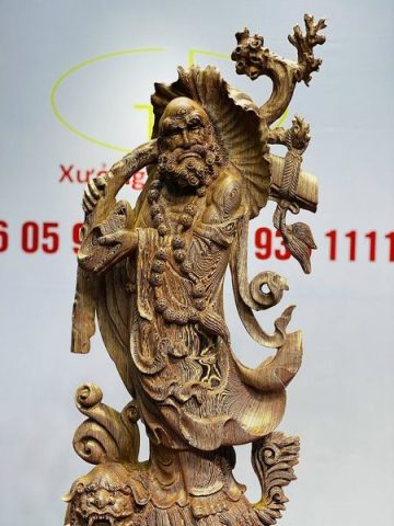 Đạt Ma Đứng Nghê Quá Hải Gỗ Mun Đuôi Công
