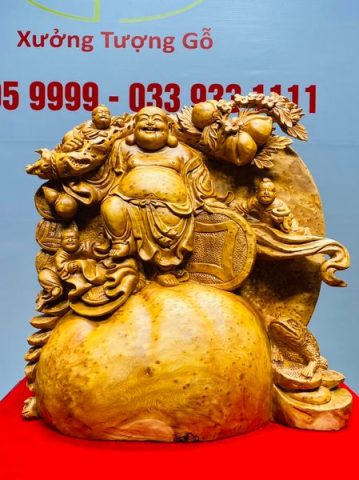 Di Lạc Tam Tiểu Vác Cành Đào Đứng Bao Tiền Gỗ Nu Ngọc Am