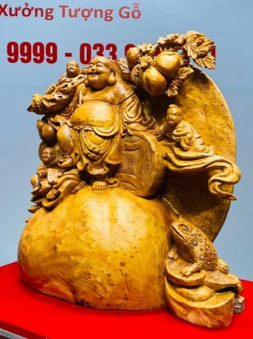 Di Lạc Tam Tiểu Vác Cành Đào Đứng Bao Tiền Gỗ Nu Ngọc Am