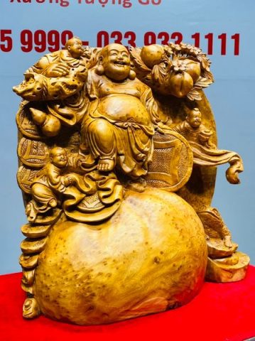 Di Lạc Tam Tiểu Vác Cành Đào Đứng Bao Tiền Gỗ Nu Ngọc Am