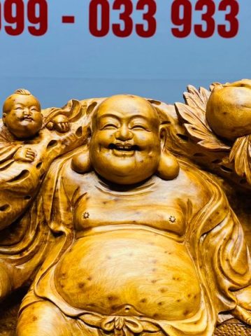 Di Lạc Tam Tiểu Vác Cành Đào Đứng Bao Tiền Gỗ Nu Ngọc Am