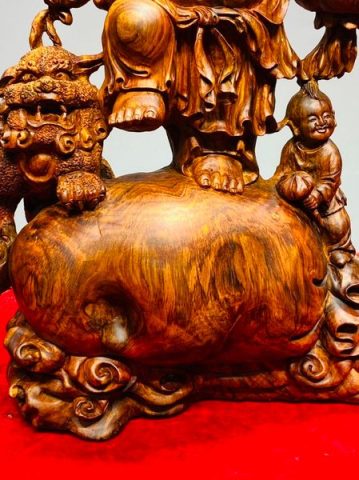 Di Lạc Vác Cành Đào Nhị Tiểu Nhất Nghê Đứng Bao Tiền Gỗ Sưa