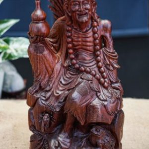 Tế công cầm bình rượu tử đàn