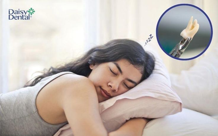 Người nằm ngủ mơ thấy rụng răng trắng